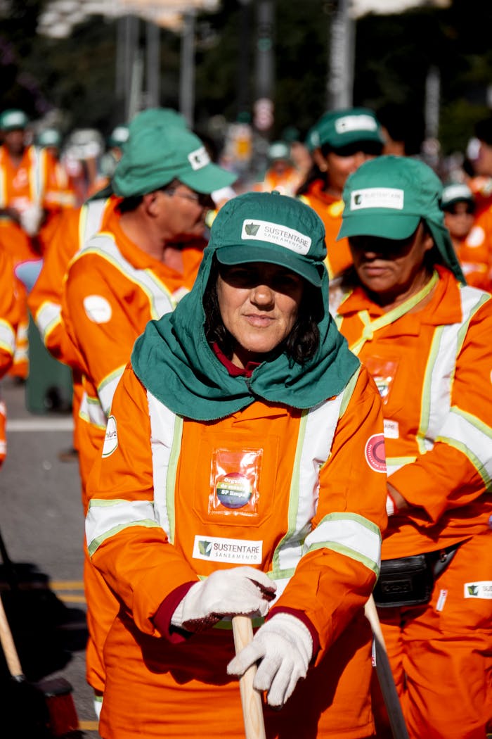 Group of uniformed street cleaners working outdoors in São Paulo, Brazil.